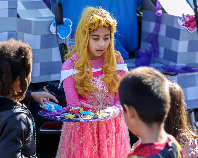 Mia Aguilera hands out candy at the La Grange Trunk or Treat event.  Oct 21, 2023