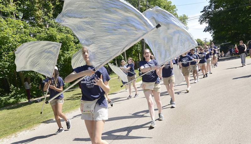 The Oswego East Marching Band moves down Main Street during the annual Memorial Day Parade and Service, Monday, May 29, 2023.