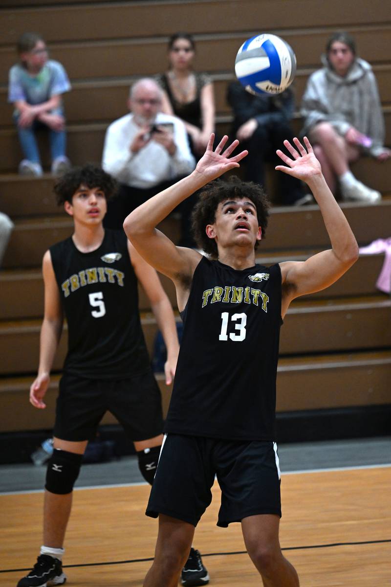 Kankakee Trinity Academy's Corey Hathaway sets the ball during the game against Manteno on Thursday, May 1, 2025.