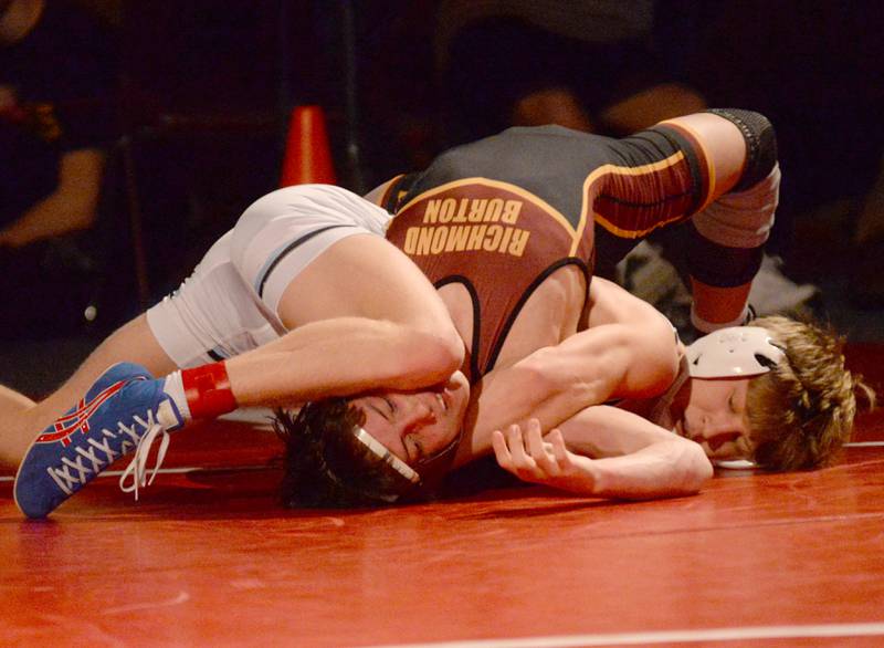 Woodstock Marian’s Brayden Teunissen and Richmond Burton’s Adam Glauser wrestle at 120 pounds in the finals at the 1A Oregon Regional on Saturday, Feb. 15, 2025.