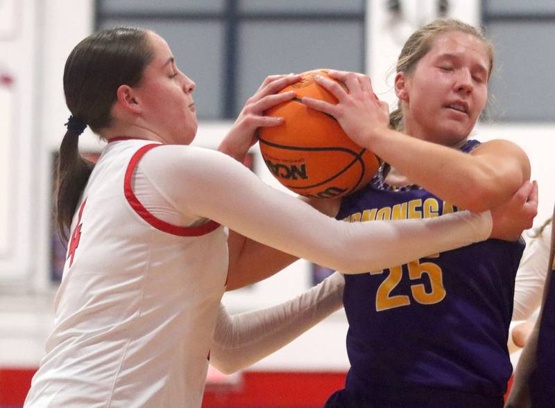 Huntley’s Maya Mangan, left, tussles with Hononegah’s Addison Beilfuss in girls basketball at Dundee-Crown High School in Carpentersville on Tuesday, November 25, 2025.