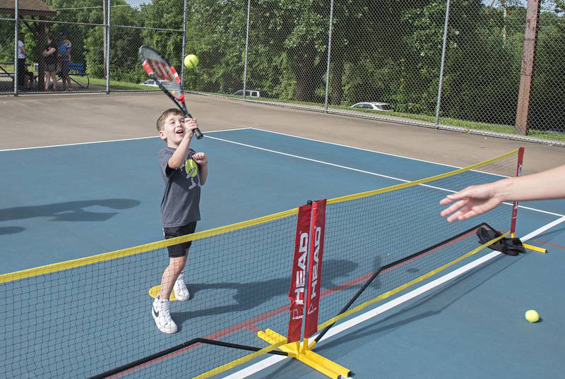 Adam Mustapha plays the ball while competing in the tiny tots event at the Emma Hubbs Tennis Classic Monday, July 25, 2022.