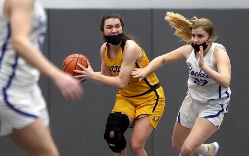 Burlington Central’s Rylie DuVal, right, pressures Jacobs’ Bridget Grady during girls varsity basketball at Burlington Tuesday night.
