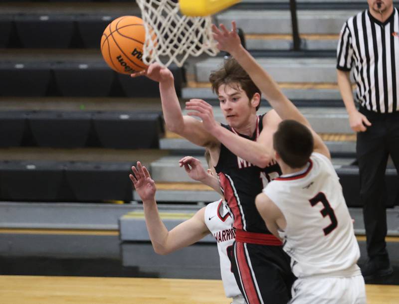 Henry-Senachwine's Wyatt Wealer looks to pass around Woodland's Grant Wissen during the Tri-County Conference Tournament on Monday, Jan. 26, 2026 at Putnam County High School
