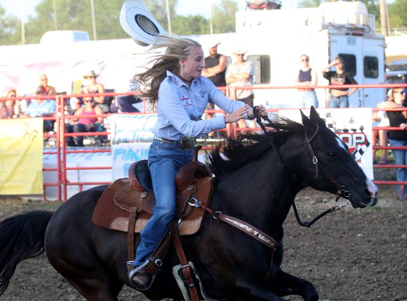 Kendall Jones of Seneca, looses her hat while barrel racing with her horse during the Starved Rock Rodeo on Saturday, June 21, 2025 at the La Salle Speedway.