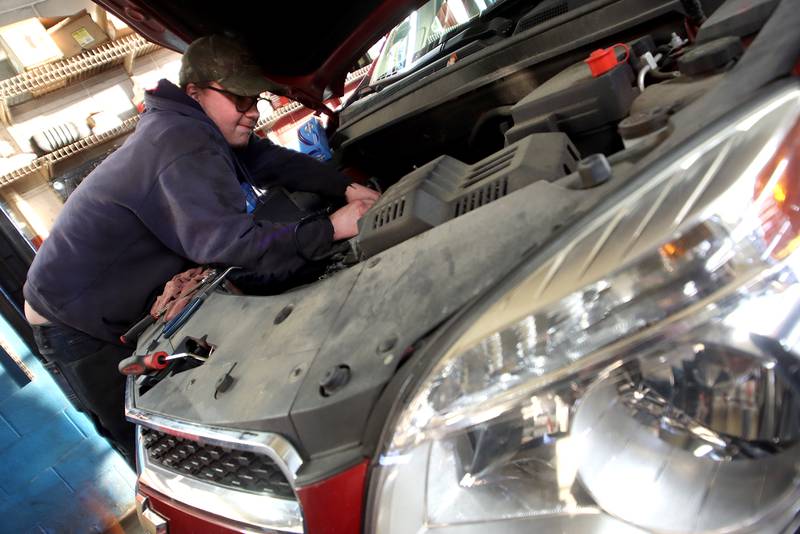 Technician Chris Dziedzic replaces a solenoid on a 2015 Chevy at Cary Tire and Auto on Thursday, Dec. 16, 2021. The local shop has experienced some of the worldwide supply chain delays which have impacted the cost and availability on replacement vehicle parts. While supply issues did not impact the repair of this particular car, Dziedzic did say he has seen recent wild fluctuations on prices and sparse availability for brake rotors.