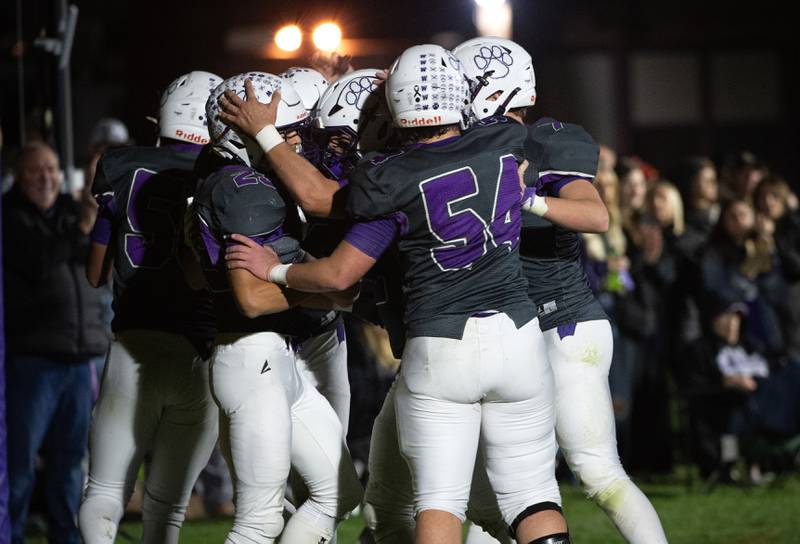 Wilmington's Hunter Kaitschuk, left, is congratulated on a touchdown in a game against Coal City on Friday, October 24, 2025.