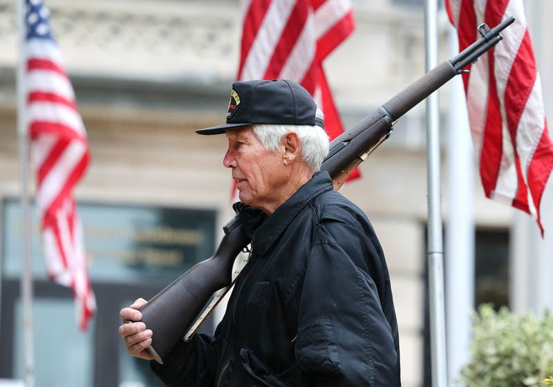 US Army Veteran Dwain Adkins holds a rifle Friday, Nov. 3, 2023, during the DeKalb County 24-Hour Veterans Vigil at the DeKalb County Courthouse in Sycamore. The vigil starts at 3 p.m. Friday and will conclude at 3 p.m. Saturday and at least one veteran will stand watch each hour of the vigil.