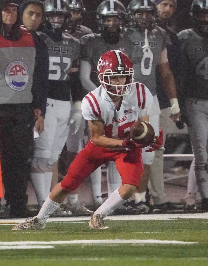 Yorkville's Dillon Jaskowski (15) catches a pass against Oswego East during a football game at Yorkville High School on Friday, Oct. 13, 2023.