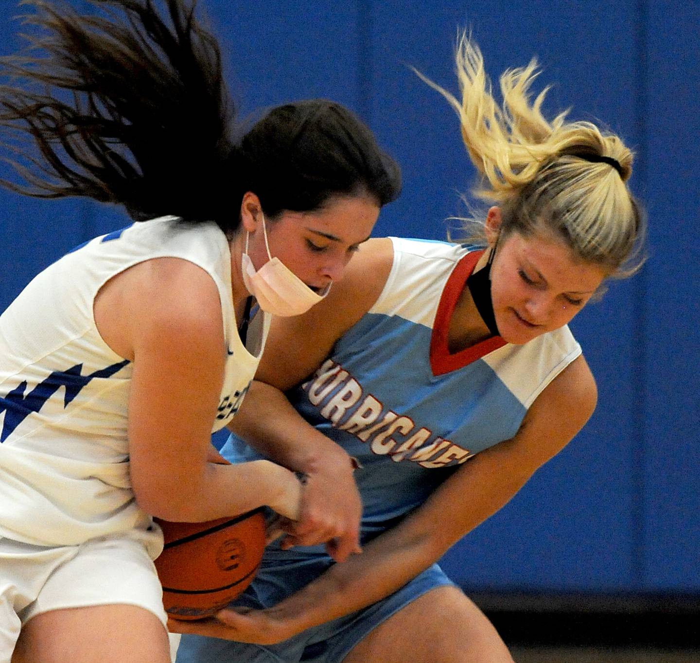 Woodstock’s Natalie Morrow tries to keep Marian Central’s Madison Kenyon from taking the ball away from her during first quarter of a basketball game in the Johnsburg Girls Basketball Thanksgiving Tournament Monday evening, Nov. 15, 2021, at Johnsburg High School.
