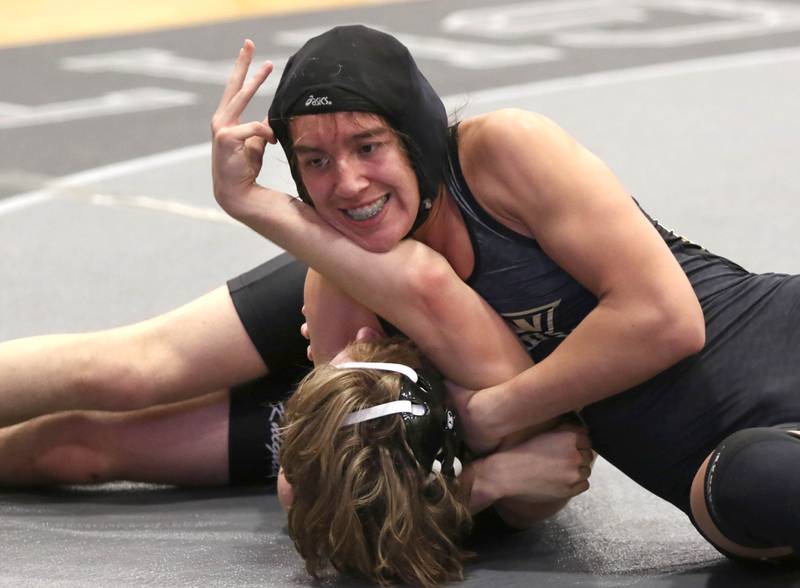 Sycamore's Luis Garcia tries to get Kaneland's Ryan Jordano to his back during their 170 pound match Thursday, Jan. 13, 2022, Kaneland High School in Maple Park.