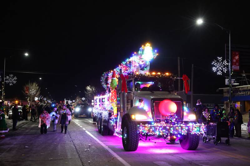 A parade float decorated by Georgie's Closet played dance party music as it traveled along Broadway Street during the 40th annual Bradley Christmas Parade on Friday, Dec. 5, 2025.