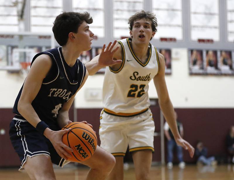 Cary-Grove's Dylan Dumele looks to shoot as Crystal Lake South's Anthony Santarelli rushes him during the IHSA Class 3A Prairie Ridge Regional championship basketball game on Friday, Feb. 28, 2025, at Prairie Ridge High School in Crystal Lake.