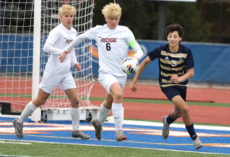 Prairie Ridge's Matthew Fireng and Lemont's Vincenzo Mancini chase down a loose ball Saturday, Nov. 9, 2024, during their Class 2A state third place game at Hoffman Estates High School.