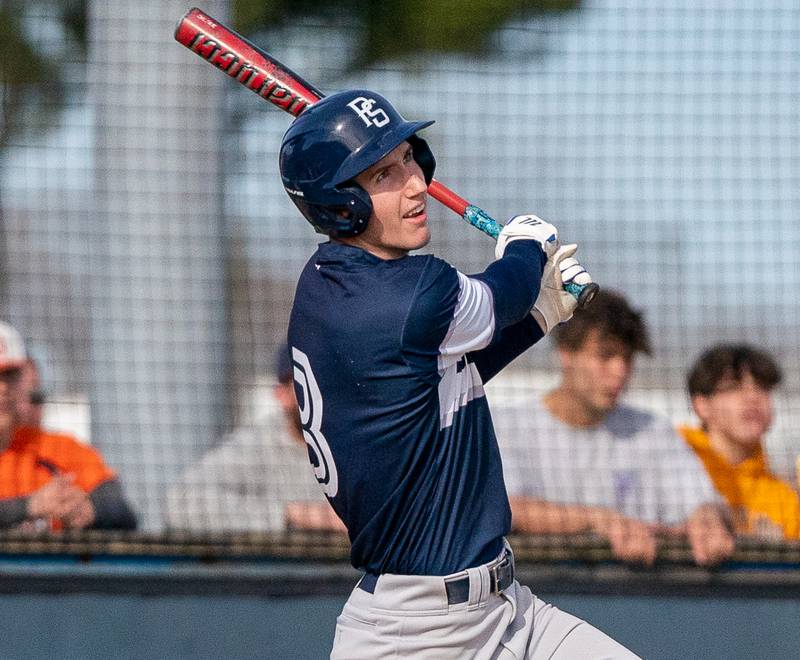 Plainfield South's Zander Tubbs (3) singles against Oswego during a baseball game at Oswego High School on Monday, April 11, 2022.