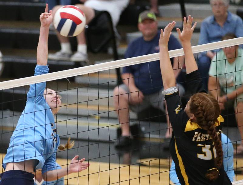 Marquette's Lily Craig sends a kill past Putnam County's Maggie Spratt on Thursday, Sept 7, 2023 at Putnam County High School.