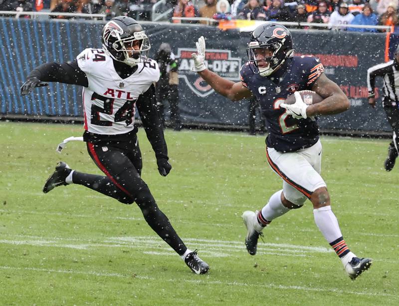 Chicago Bears wide receiver DJ Moore fends off Atlanta Falcons cornerback A.J. Terrell during their game Sunday, Dec. 31, 2023, at Soldier Field in Chicago.