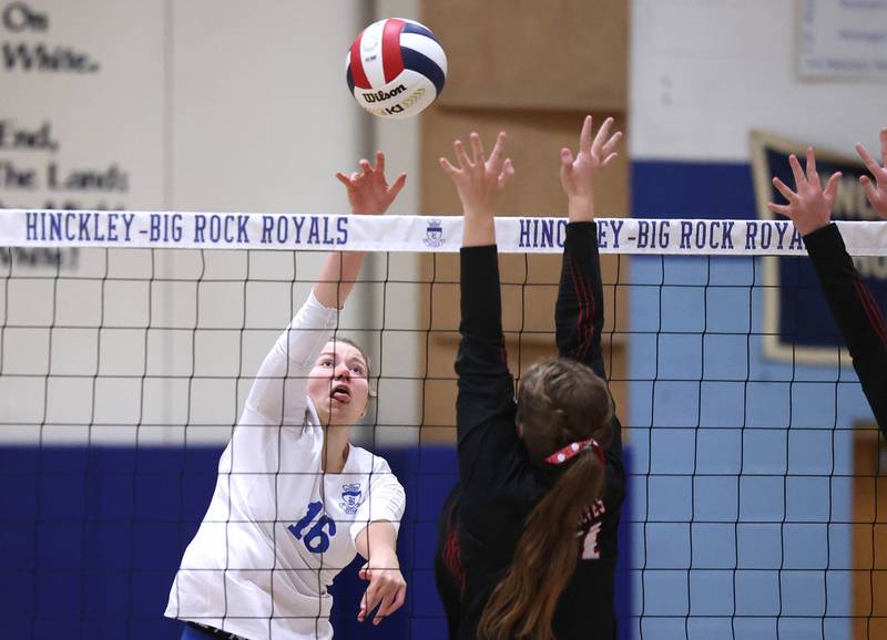 Hinckley-Big Rock's Grace Barrett tips the ball over Indian Creek's Cheyenne Buh during their match Tuesday, Sept. 24, 2024, at Hinckley-Big Rock High School.
