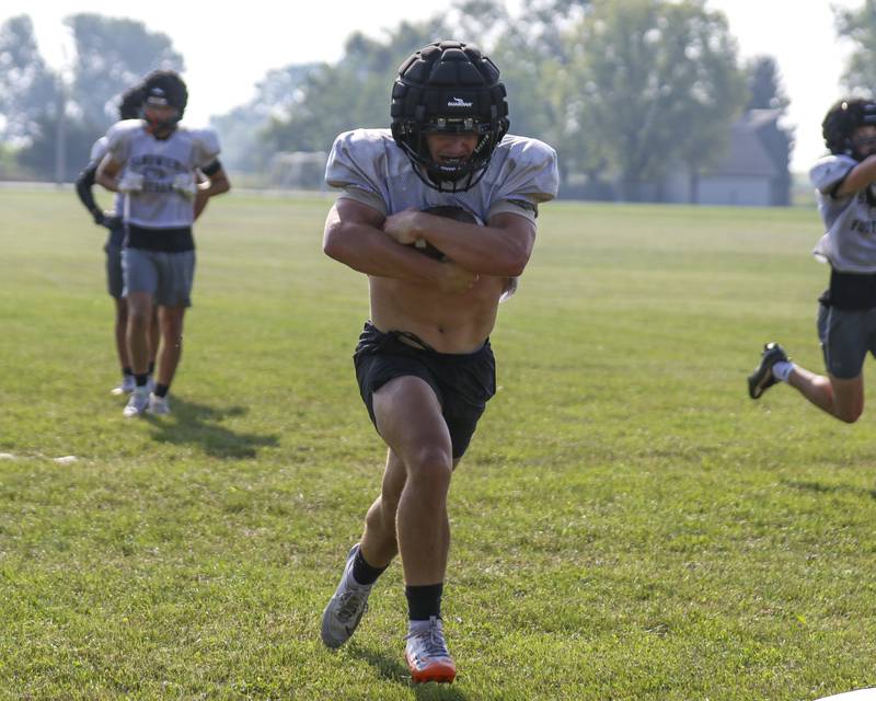 Jeff Ashley runs with the ball during Sandwich football practice Tuesday, July 22, 2025  in Sandwich.
