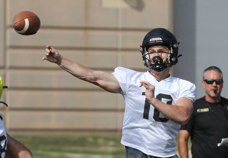 Sycamore quarterback Burke Gautcher throws a pass during practice Monday, Aug. 7, 2023, at Sycamore High School.