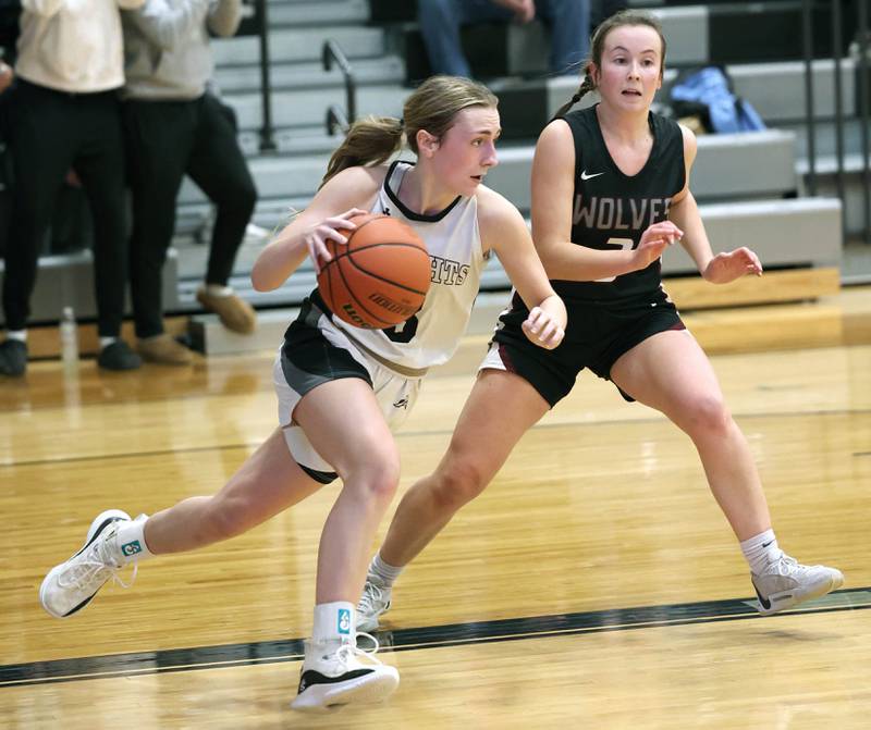 Kaneland's Alexis Schueler pushes the ball ahead of Prairie Ridge's Zoe Nanos Thursday, Feb 15, 2024, during their Class 3A regional final game at Kaneland High School in Maple Park.