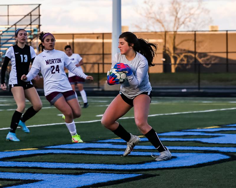 Willowbrook's Maddie Aderholt (11) comes up with a save during soccer match between Morton at Willowbrook. April 14, 2022.