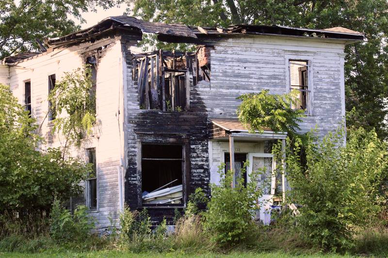 A dilapidated home at 122 Cherry in Compton as it appeared on Wednesday, nearly four years after it was damaged a fire, that has been identified as needing demolished by Lee County.