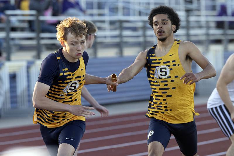 Sterling’s Quincy Maas hands the baton off to Aiden Lacy in the 4x4 Wednesday, May 20, 2026, at the Rochelle Class 2A boys track sectionals. The team won the heat and qualified for state.