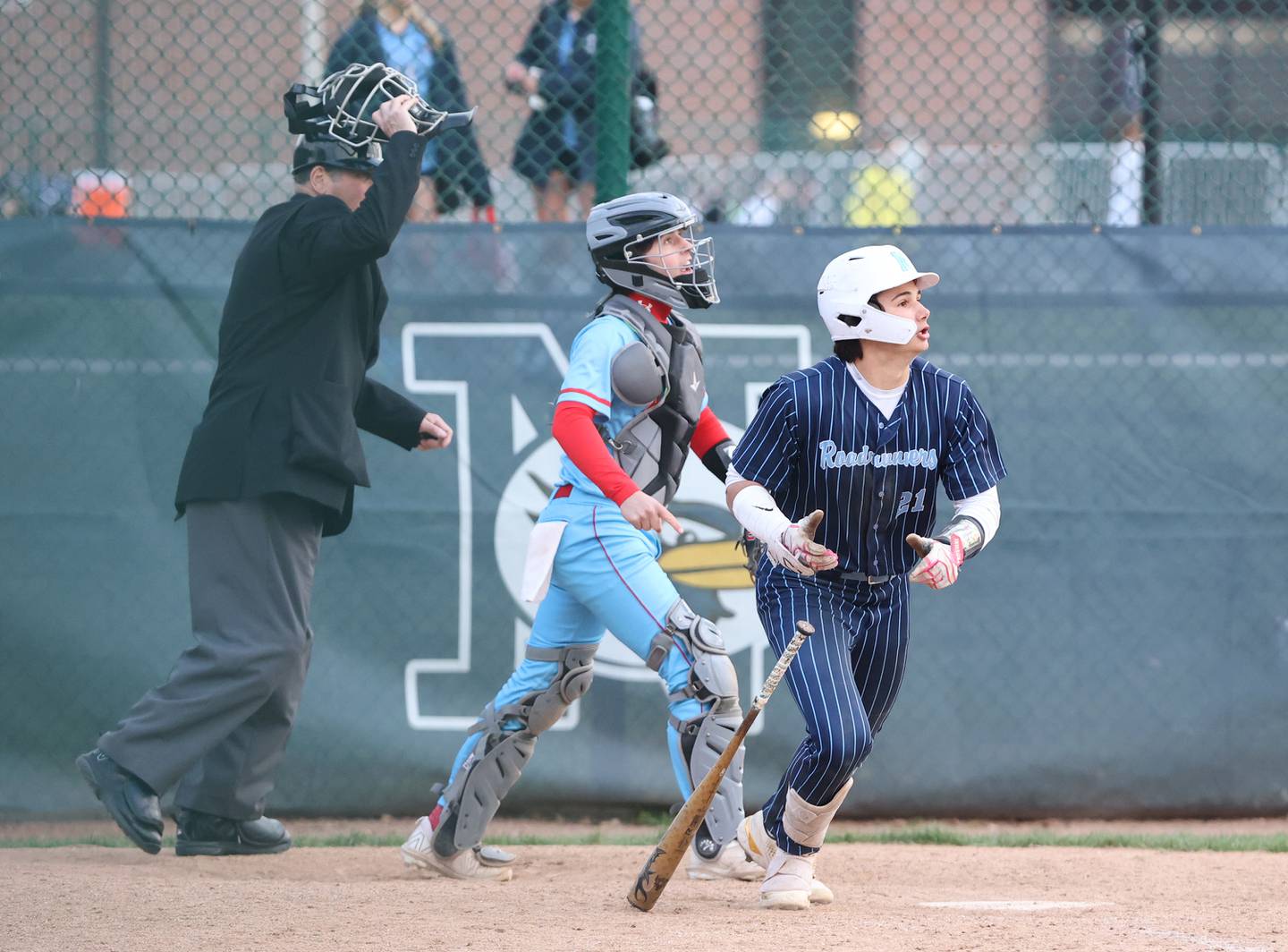 Nazareth's Jaden Fauske (21) runs after making contact during the varsity baseball game between Benet Academy and Nazareth Academy in La Grange Park on Monday, April 24, 2023.