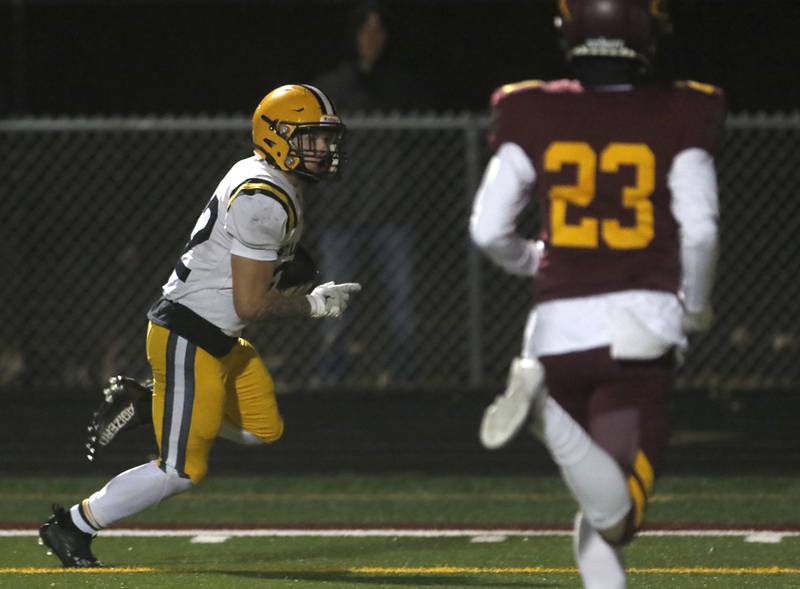 St. Laurence's Harley Rizzs runs down the sidelines to score a touchdown during an IHSA Class 4A first-round football game against Richmond-Burton on Friday, Nov. 1, 2024, at Richmond-Burton High School in Richmond.