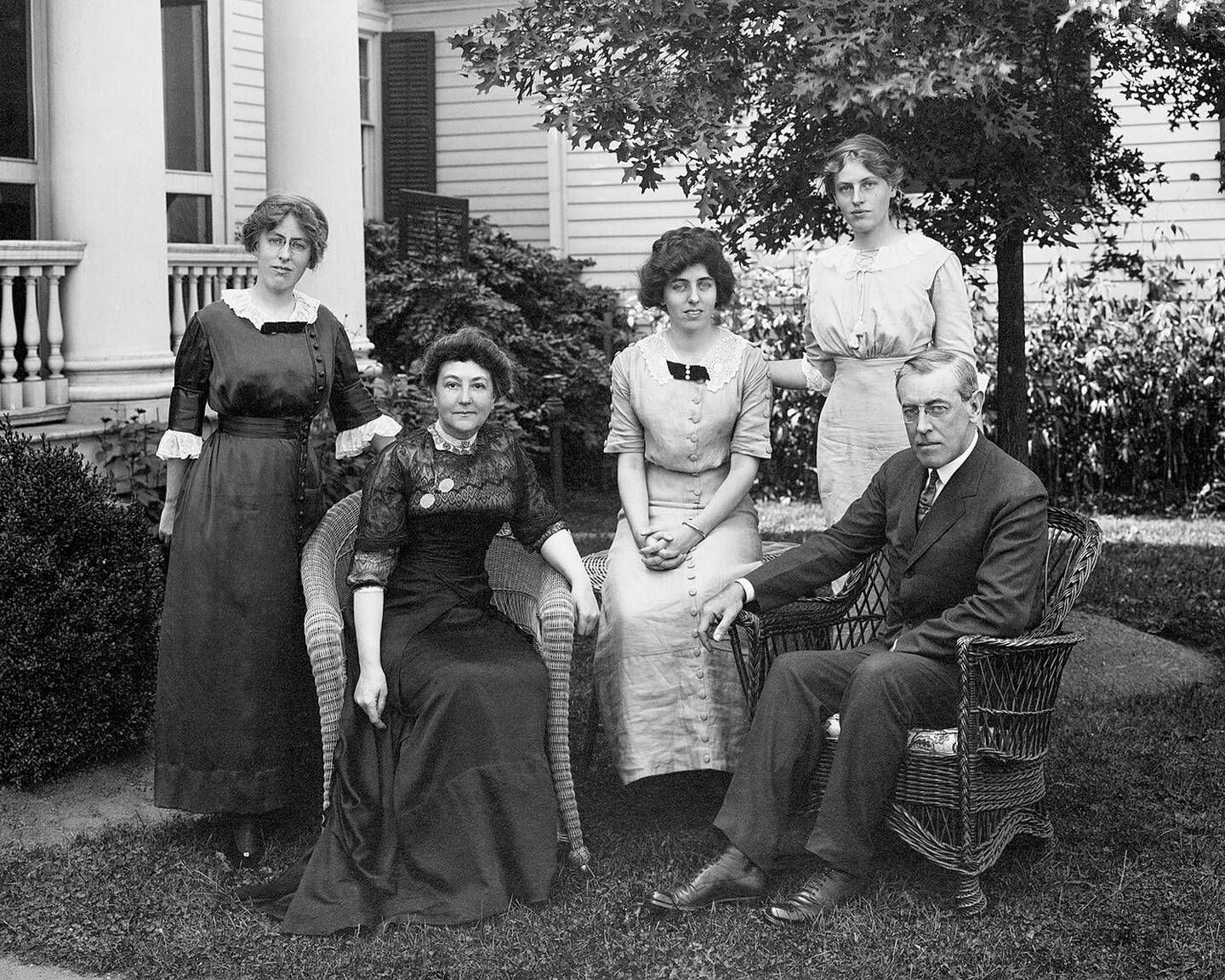 Woodrow and Ellen Wilson are seated outdoors with their three daughters – Margaret (from left), Eleanor and Jessie – standing behind them in Cornish, New Hampshire, in 1912.