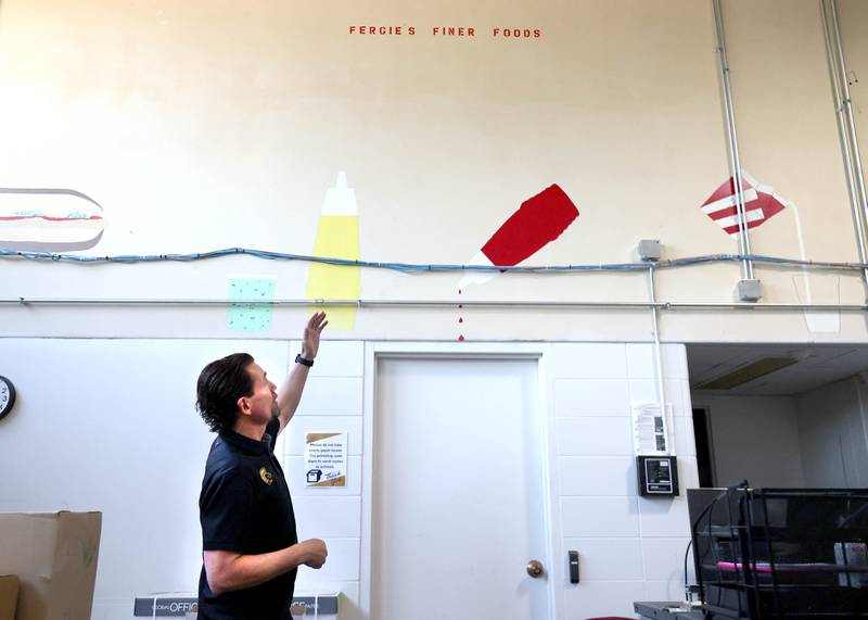 Steve Wilder, superintendent of Sycamore School District 427, talks Tuesday, June 18, 2025, about a mural that was painted in the cafeteria/gymnasium of the former Central School in Sycamore. The nearly century old building currently houses the district offices but will soon be for sale. The district is hosting an open house at the building Saturday, June 21.