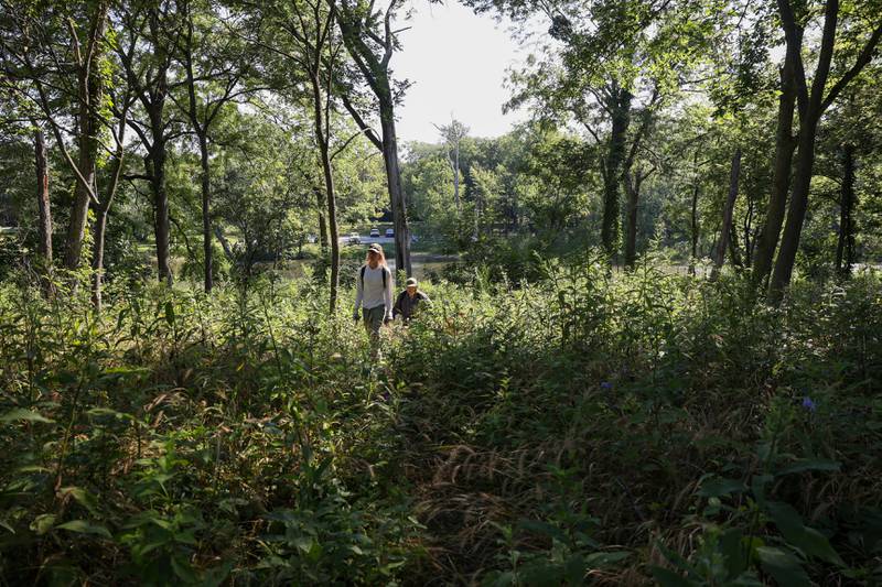 Volunteers Craig Goodwin, left, and Karen Horn arrive to Langham Island for a Friends of Langham Island stewardship day on Aug. 9, 2025.
