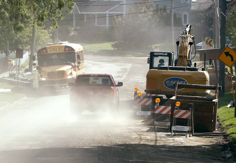 Traffic navigates roads construction along Dean Street in Woodstock Tuesday, Aug. 23, 2022. A lot of road construction programs in McHenry County cities are wrapping up, but some road projects, though will see work into the fall.