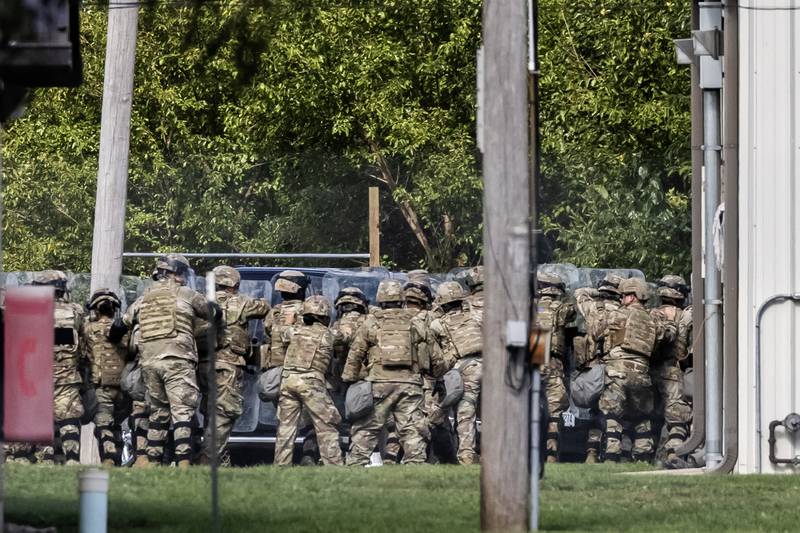 Soldiers participate in what seems to be a training exercise at the Joliet Local Training Area site for the Illinois National Guard at 20612 Arsenal Road in Elwood on Wednesday, Oct. 8, 2025.