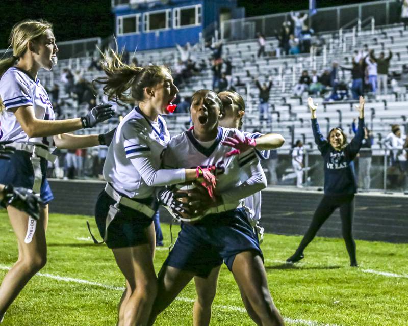 Oswego East's Avaya Kittling-turner (3) celebrates her late touchdown to tie up the game during Oswego East Regional Final flag football game between St. Charles North at Oswego East Thursday, Oct 9, 2025 in Oswego.