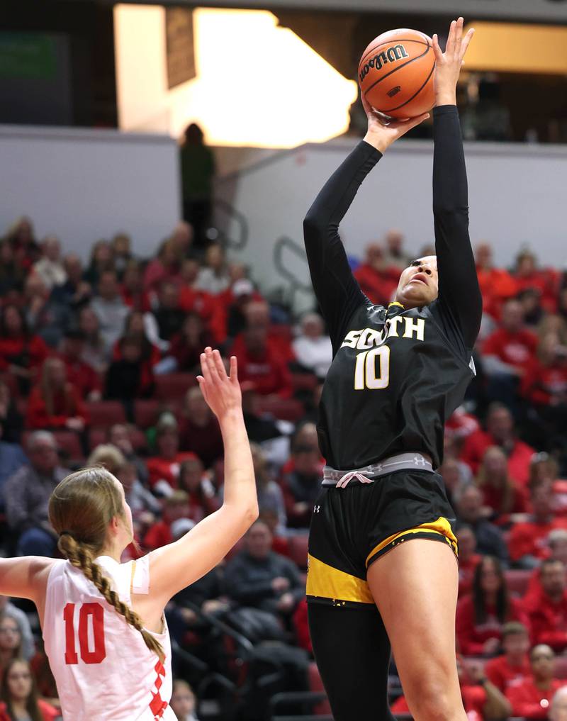 Hinsdale South's Amerie Flowers scores over Glenwood's Makenna Yeager during their game Friday, March 1, 2024, in the IHSA Class 3A state semifinal at the CEFCU Arena at Illinois State University in Normal.