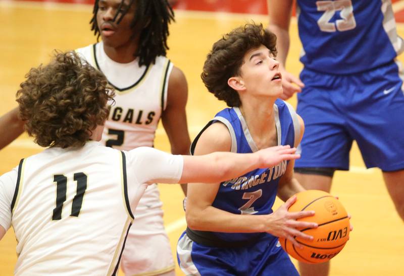 Princeton's Stihl Brokaw grabs a rebound over Oak Forest's Will Englund during the Dean Riley Shootin' The Rock Thanksgiving Tournament on Tuesday, Nov. 26, 2024 in Kingman Gym at Ottawa High School.