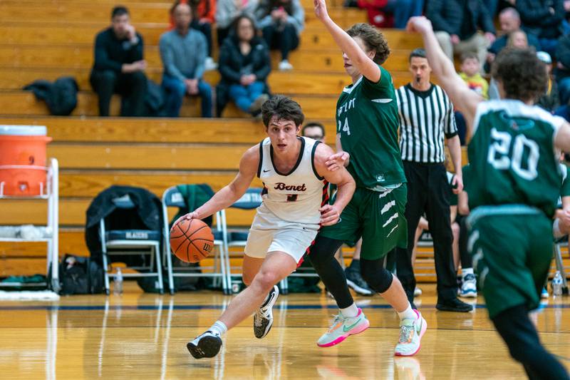 Benet’s Brady Kunka (3) drives the baseline against Bartlett's Dimitre Petrasiunas (24) during the 4A Addison Trail Regional final at Addison Trail High School in Addison on Friday, Feb 24, 2023.