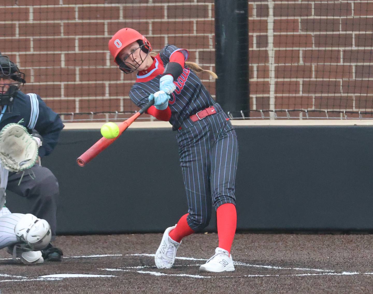 Ottawa's Teagan Darif hits her second home run against Seneca on Friday, May 1, 2026 at Seneca High School.
