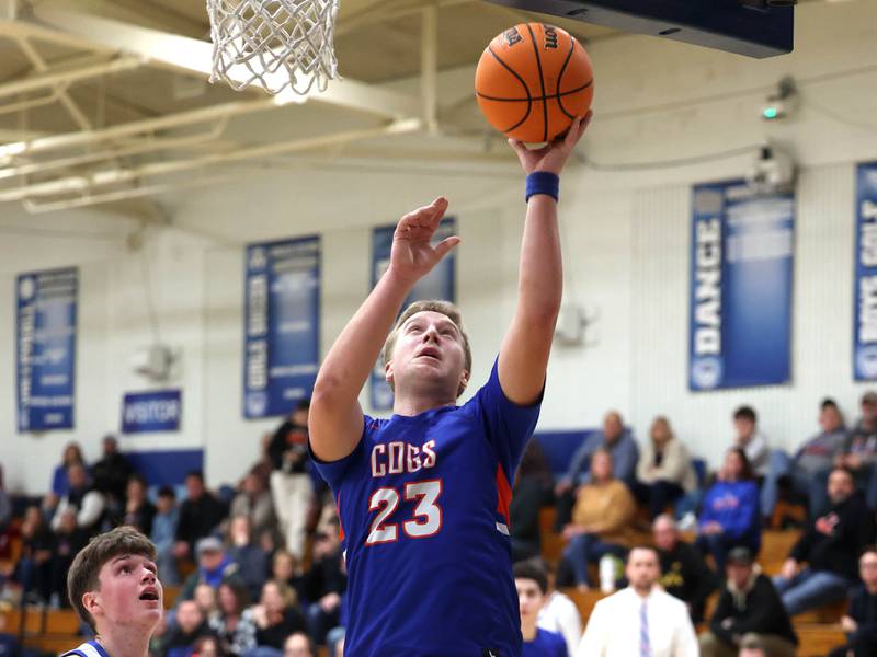 Genoa-Kingston's Hayden Hodgson gets a layup in front of Hinckley-Big Rock's Max Hintzsche during their game Tuesday, Jan. 7, 2025, at Hinckley-Big Rock High School.