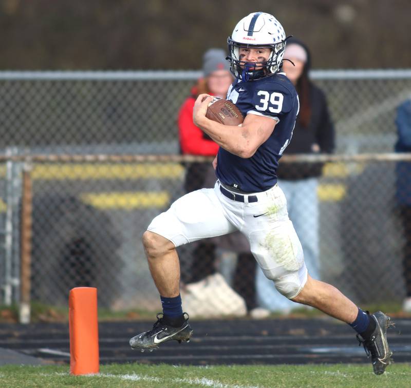 Cary-Grove’s Holden Boone scores a touchdown against Belvidere North in IHSA Class 6A quarterfinal playoff football action on Saturday, Nov. 16, 2024, at Al Bohrer Field on the campus of Cary-Grove High School in Cary.
