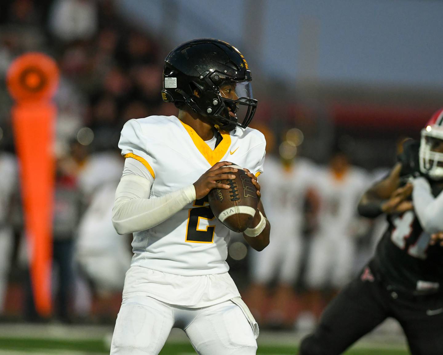Joliet West's Landon Mars (2) looks for an open teammate during the game on Friday Sept. 5, 2025, while traveling to take on Yorkville High School.