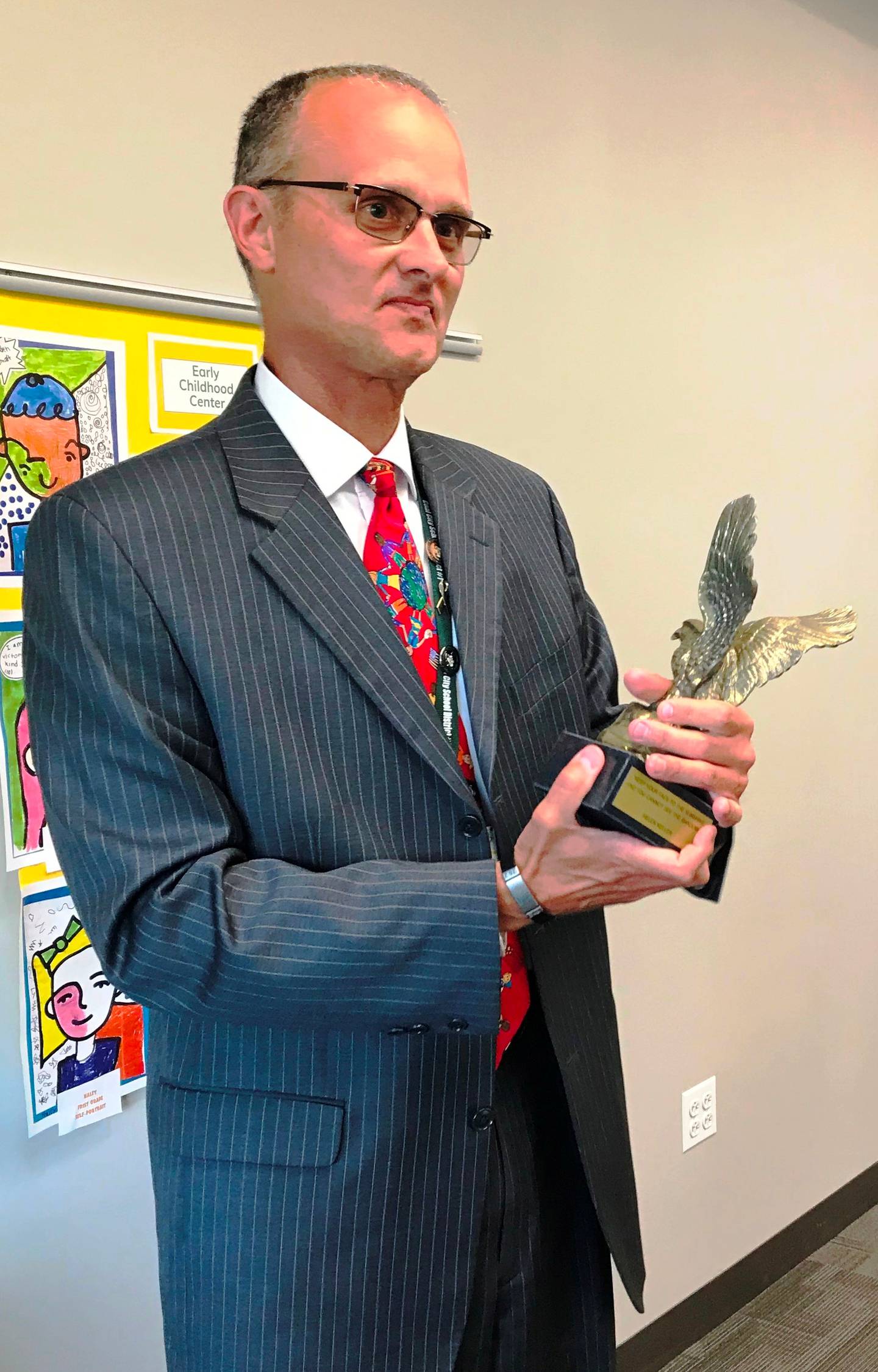 Dr. Kent A. Bugg with his Bronze Eagle award, presented by St. Juvin Post 1336 Veterans of Foreign Wars of the United States