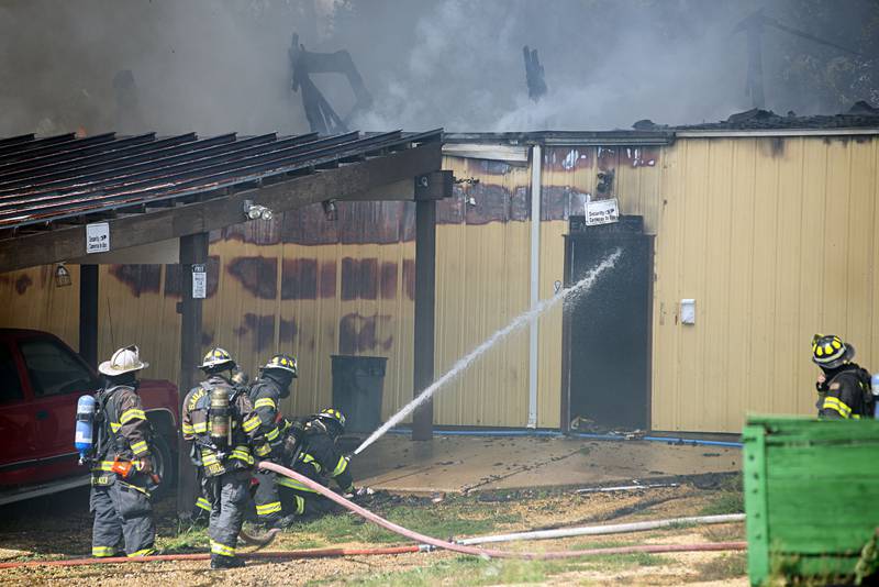 Firefighters work at the scene of a fire at 300 block of Cropsey avenue in Dixon on Monday, Sept. 26, 2022.