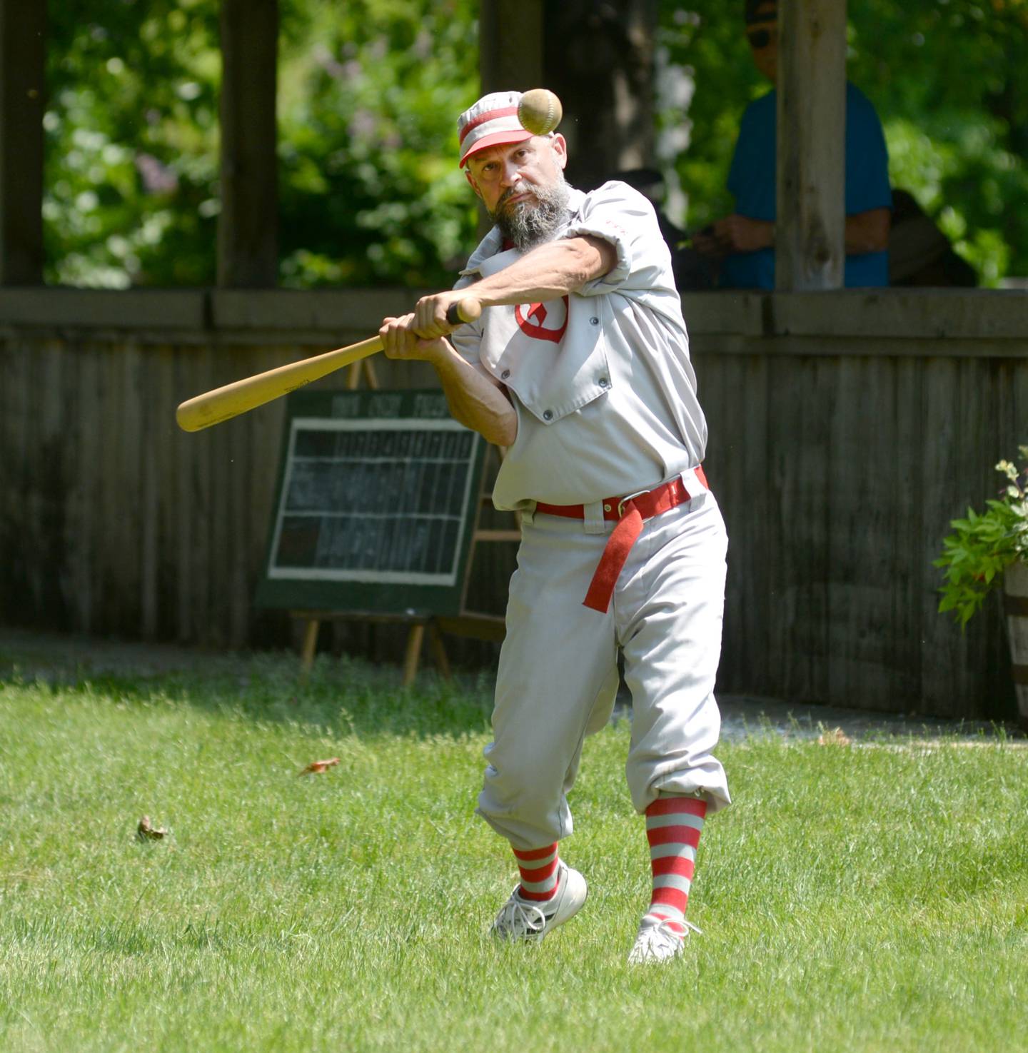Mike "t-Bag" Thomas watches a pitch as he bats for the Oregon Ganymedes Vintage Base Ball team during a game with the DuPage Plowboys on Saturday, June 3 at the John Deere Historic Site in Grand Detour.