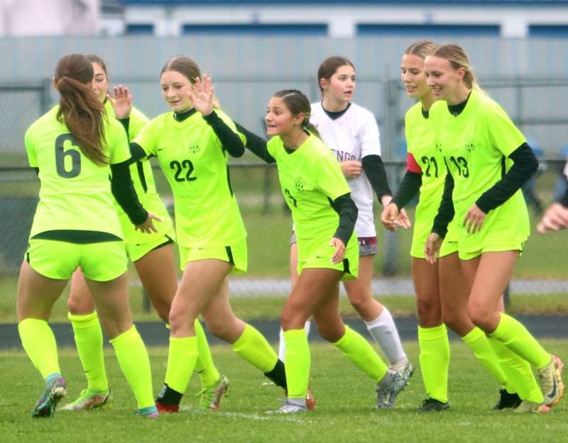 Richmond-Burton’s Rockets celebrate a goal by Abbie Leslie, center, in IHSA Class 1A Regional Title Game action soccer at Marengo High School in Marengo on Wednesday, May 21, 2025.