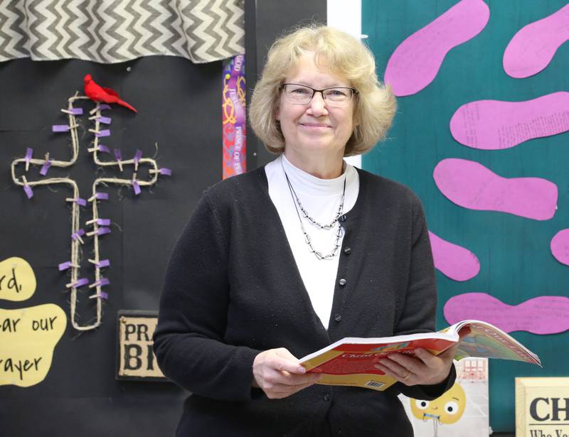 Mrs. Lynn Quick poses for a photo on Wednesday, March 22, 2023 at Holy Family School in Oglesby.