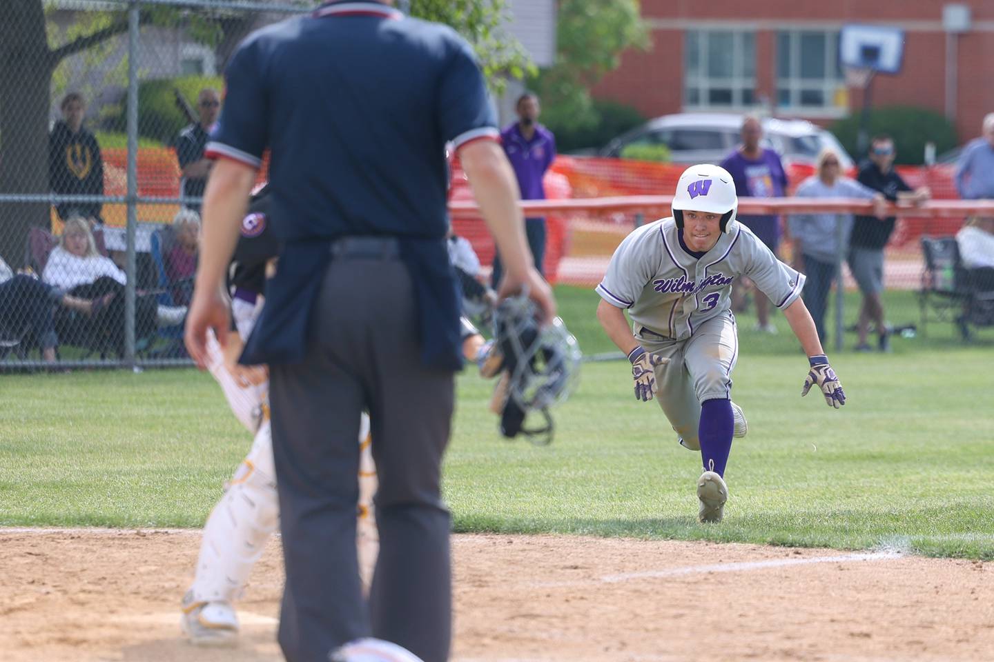Wilmington's Shawn James prepares to slide into home for a run during the Wildcats 7-2 victory over Chicago Christian in the IHSA Class 2A Beecher Sectional semifinal on Thursday, May 29, 2025.