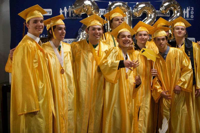 Seniors gather for one more group photo before the Jacobs High School graduation ceremony on May 21, 2022, at the NOW Arena in Hoffman Estates.